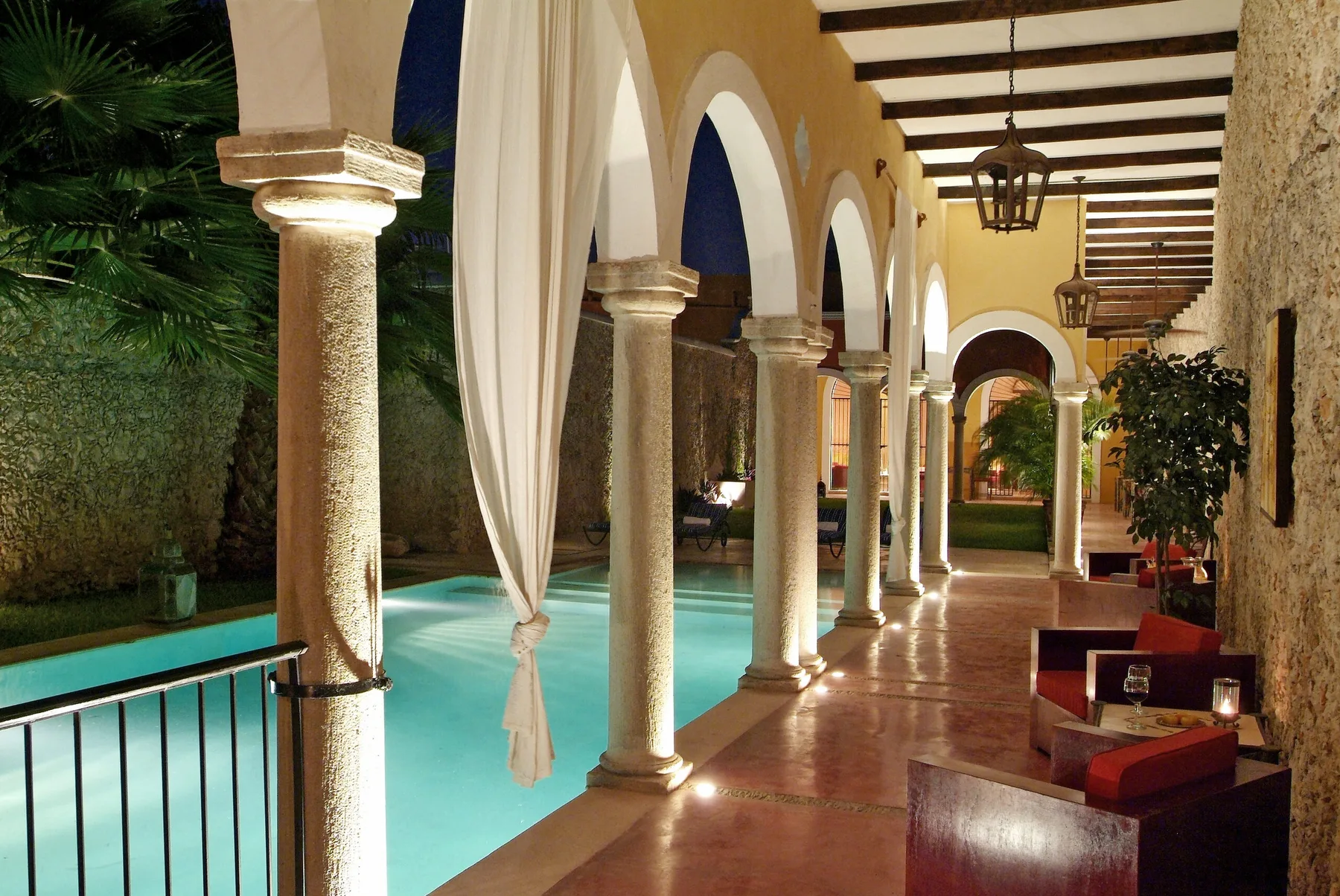 Pool and arches at night, Hotel Hacienda Mérida
