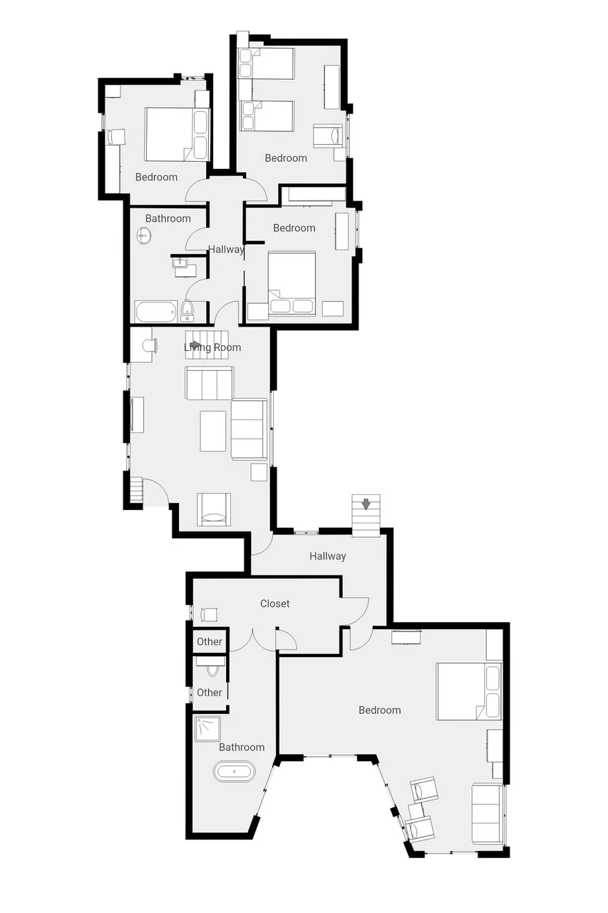 Un plano en blanco y negro muestra dormitorios, baños, una sala de estar y pasillos.