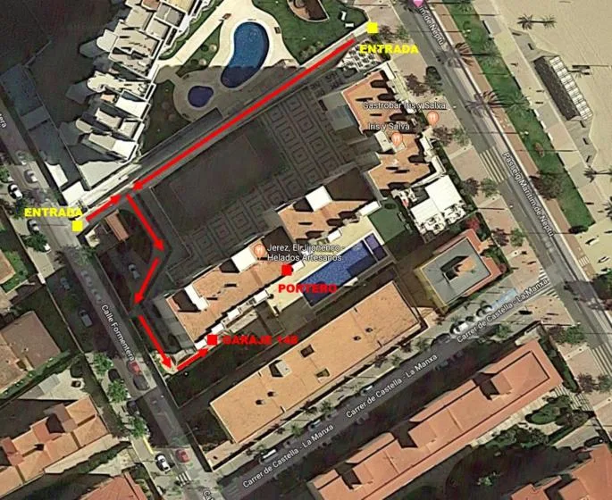 An aerial view of a building complex with red route markings and entrance labels.