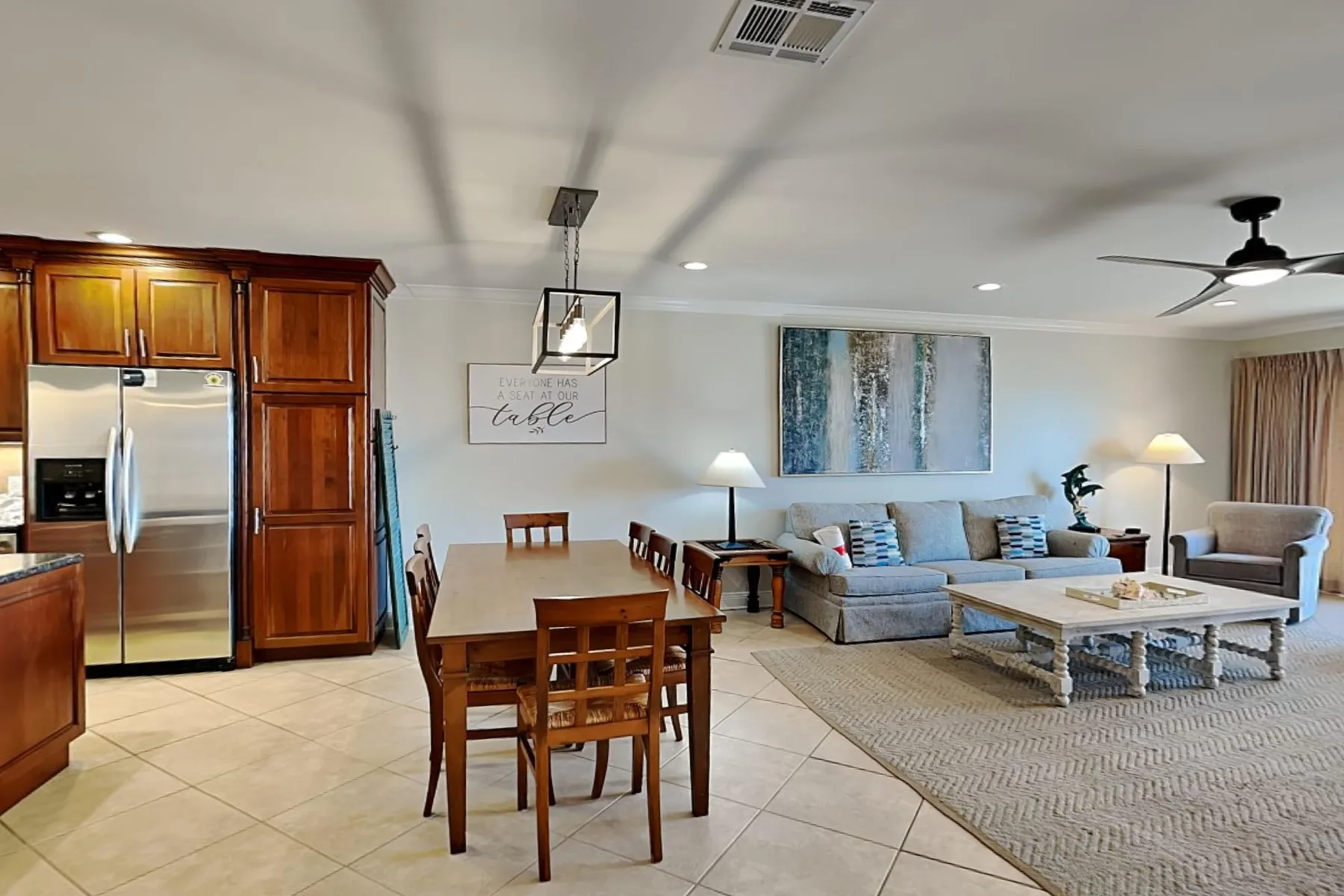 An open-plan living and dining area with a dining table and seating.