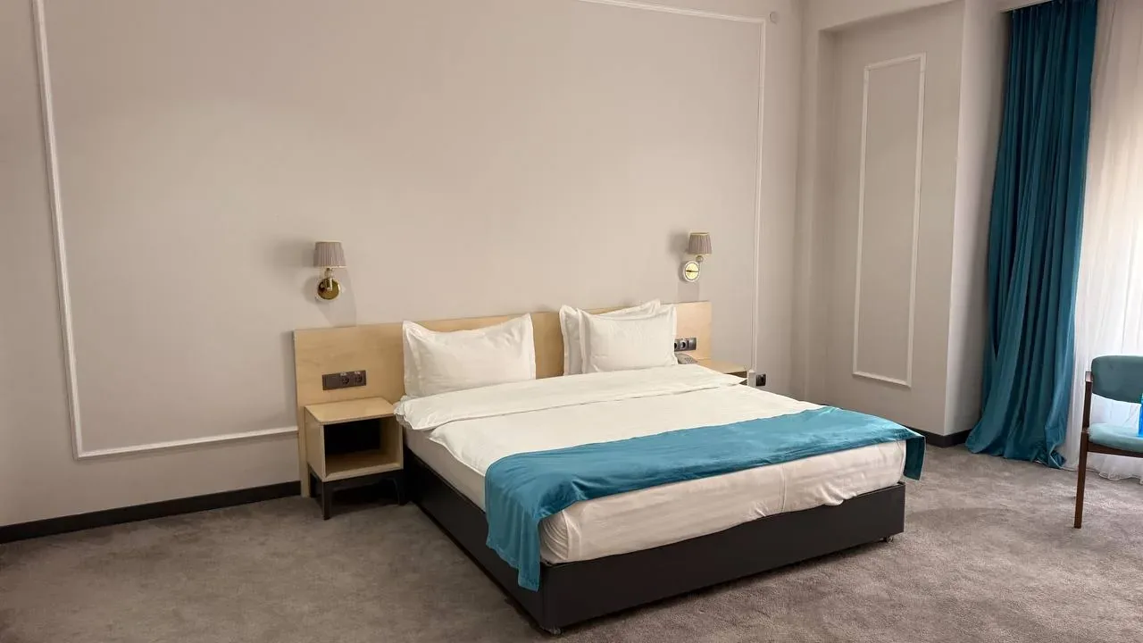 Suite bedroom with a king-size bed