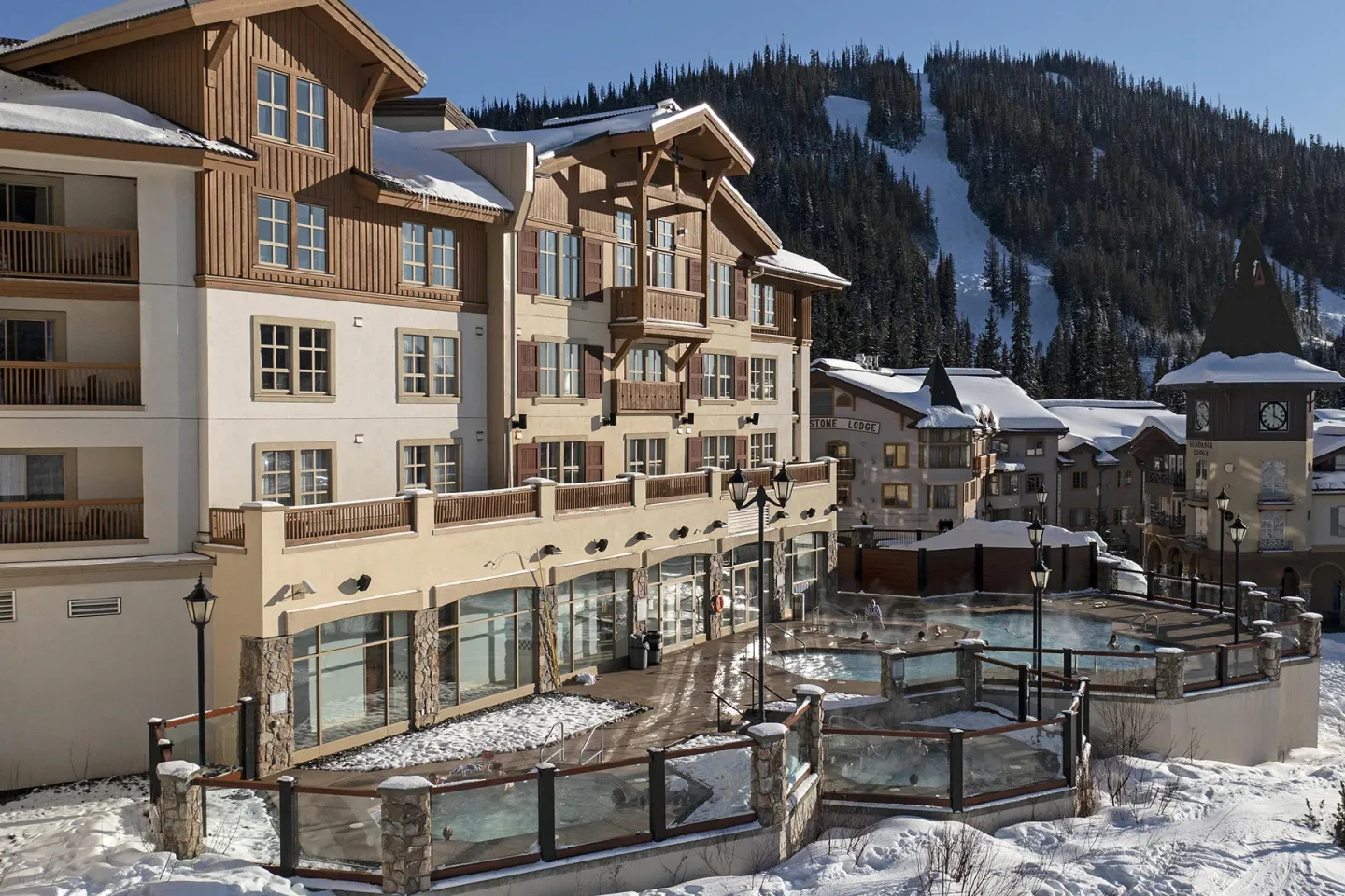 Sun Peaks Grand resort building in a snowy mountain setting.