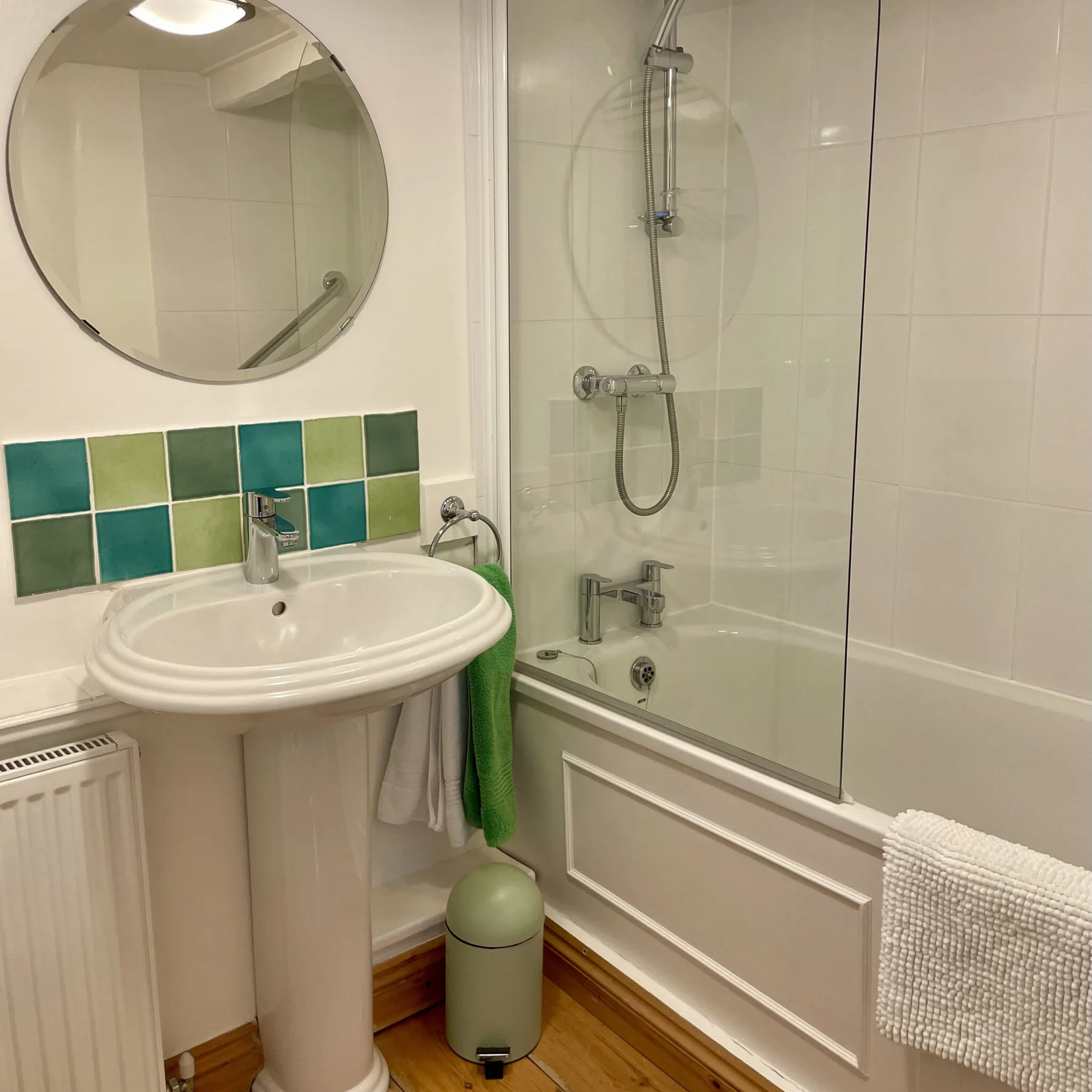 Tamarisk en-suite bathroom with a bath, overhead shower and washbasin