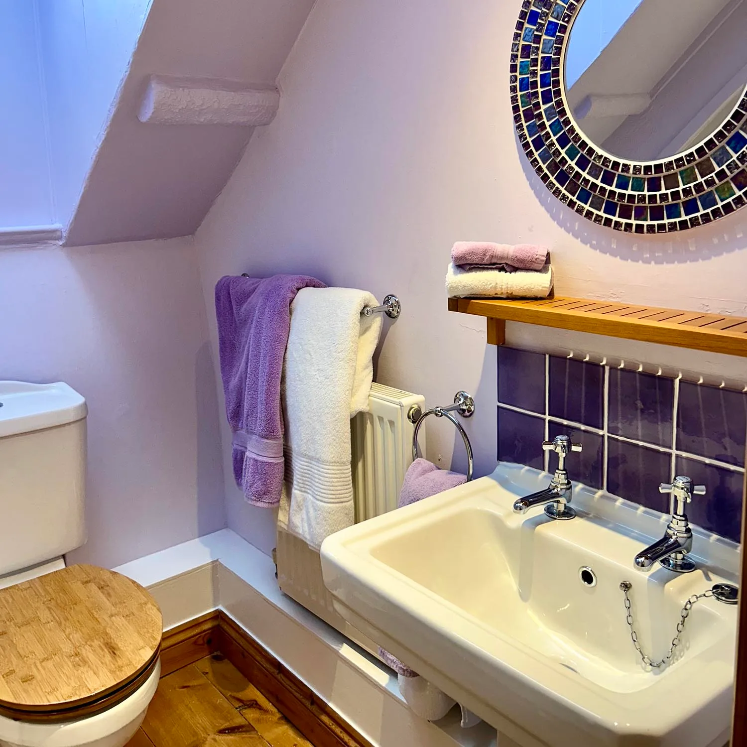 Washbasin and lilac tiles in the Marram en-suite bathroom