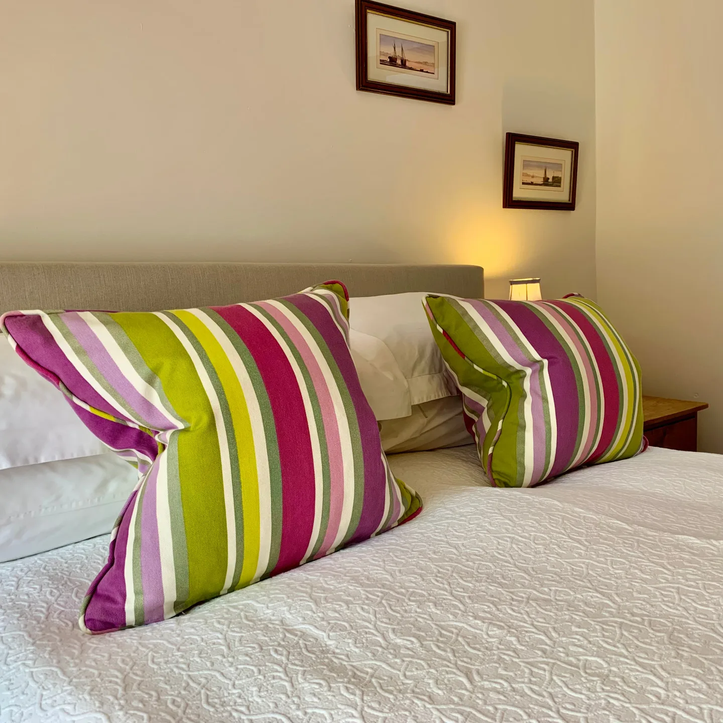 Colourful striped cushions and soft furnishings in the Marram room