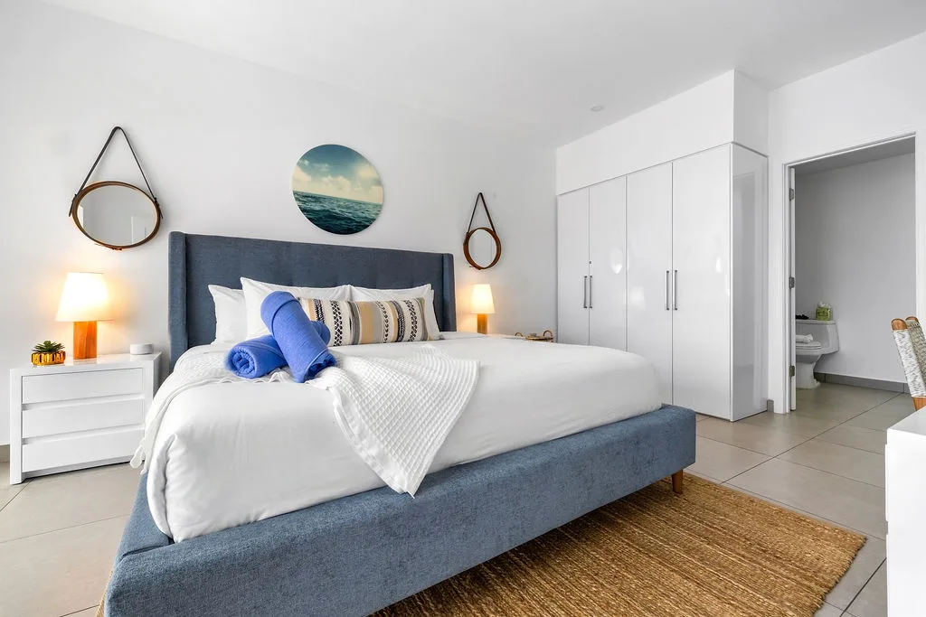 Sink into cloud-like comfort in your serene bedroom with soothing coastal accents that make every morning feel like a fresh start.