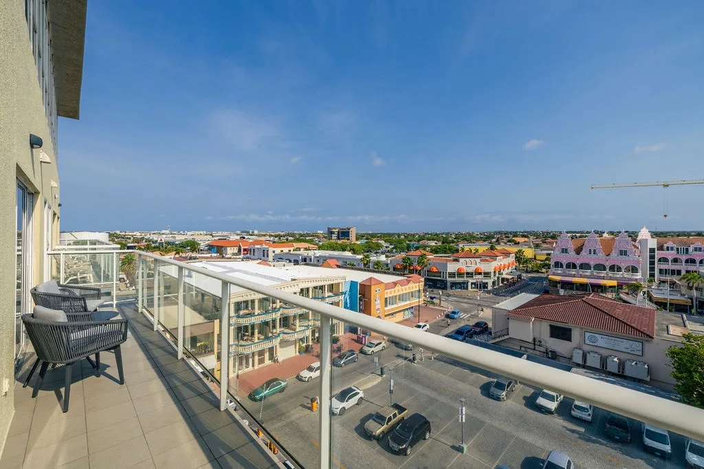 Step onto your private balcony and soak in the stunning panoramic views of the colorful Caribbean town below.