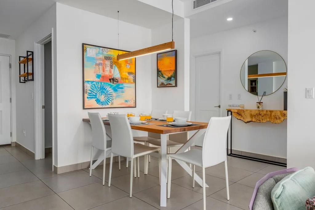 Your stylish dining space features contemporary artwork and elegant furnishings, perfect for memorable meals together.