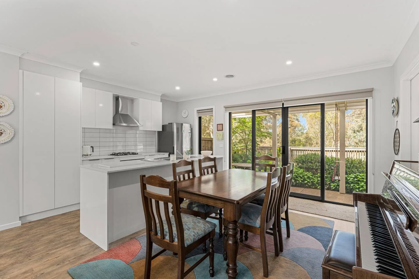 The dining area is filled with natural light, creating a welcoming setting for leisurely breakfasts or intimate evening meals.