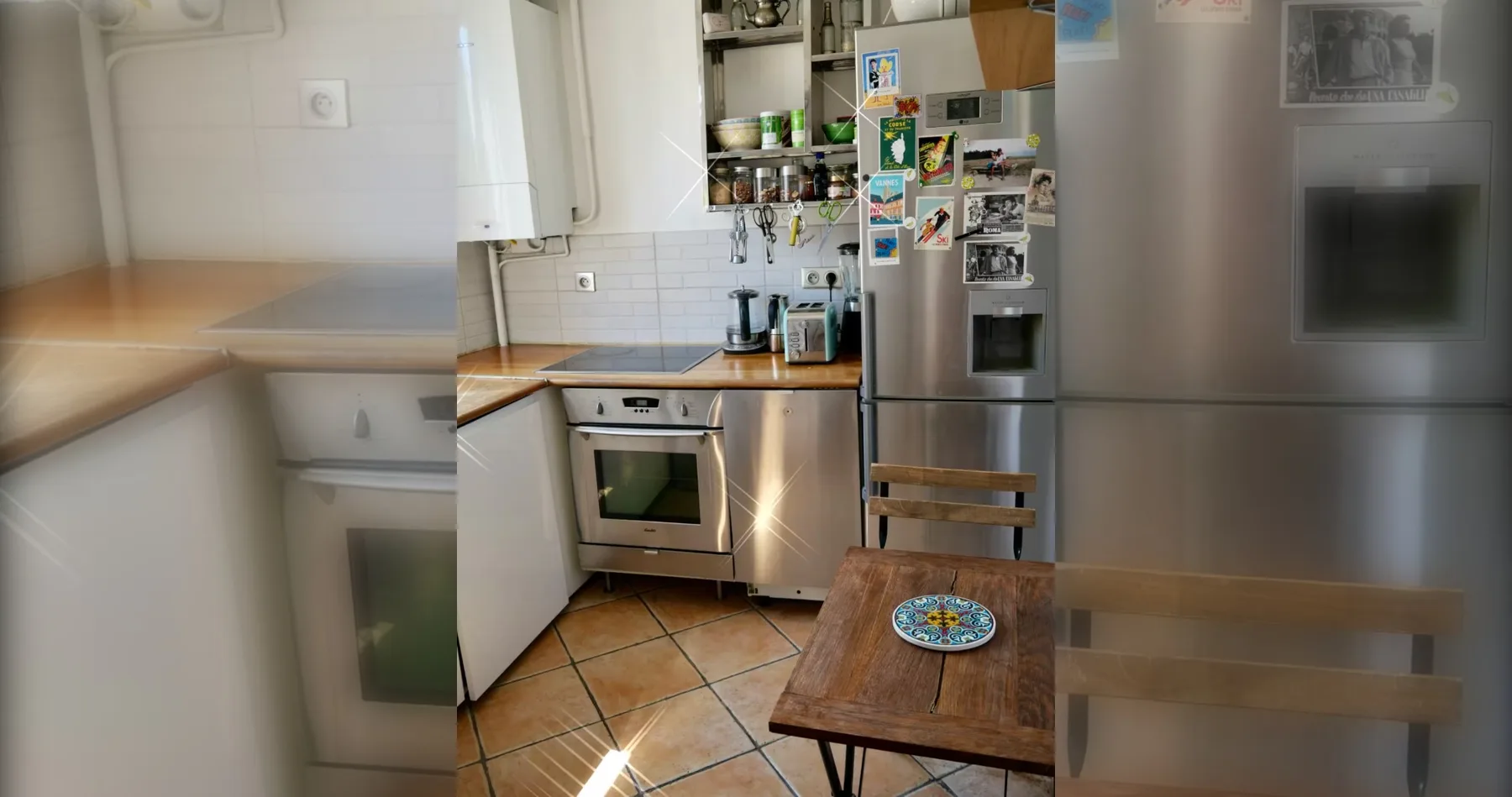 A kitchen with wood countertops, stainless steel appliances, and a dining table.