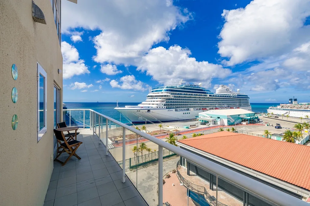 The property is located in a coastal area with views of the cruise port and waterfront, offering guests convenient access to maritime activities and nearby attractions.