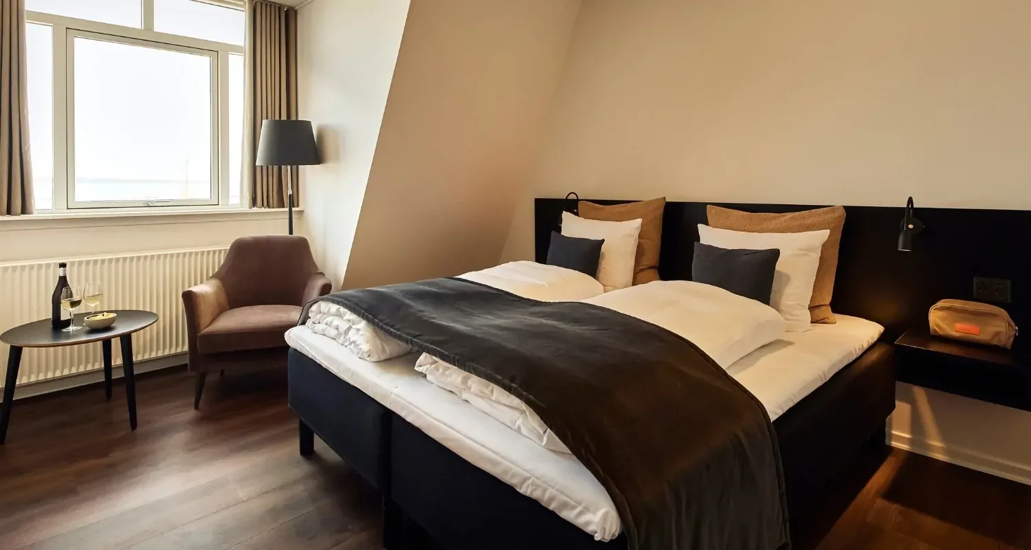 Cama doble hecha en una Grand Suite