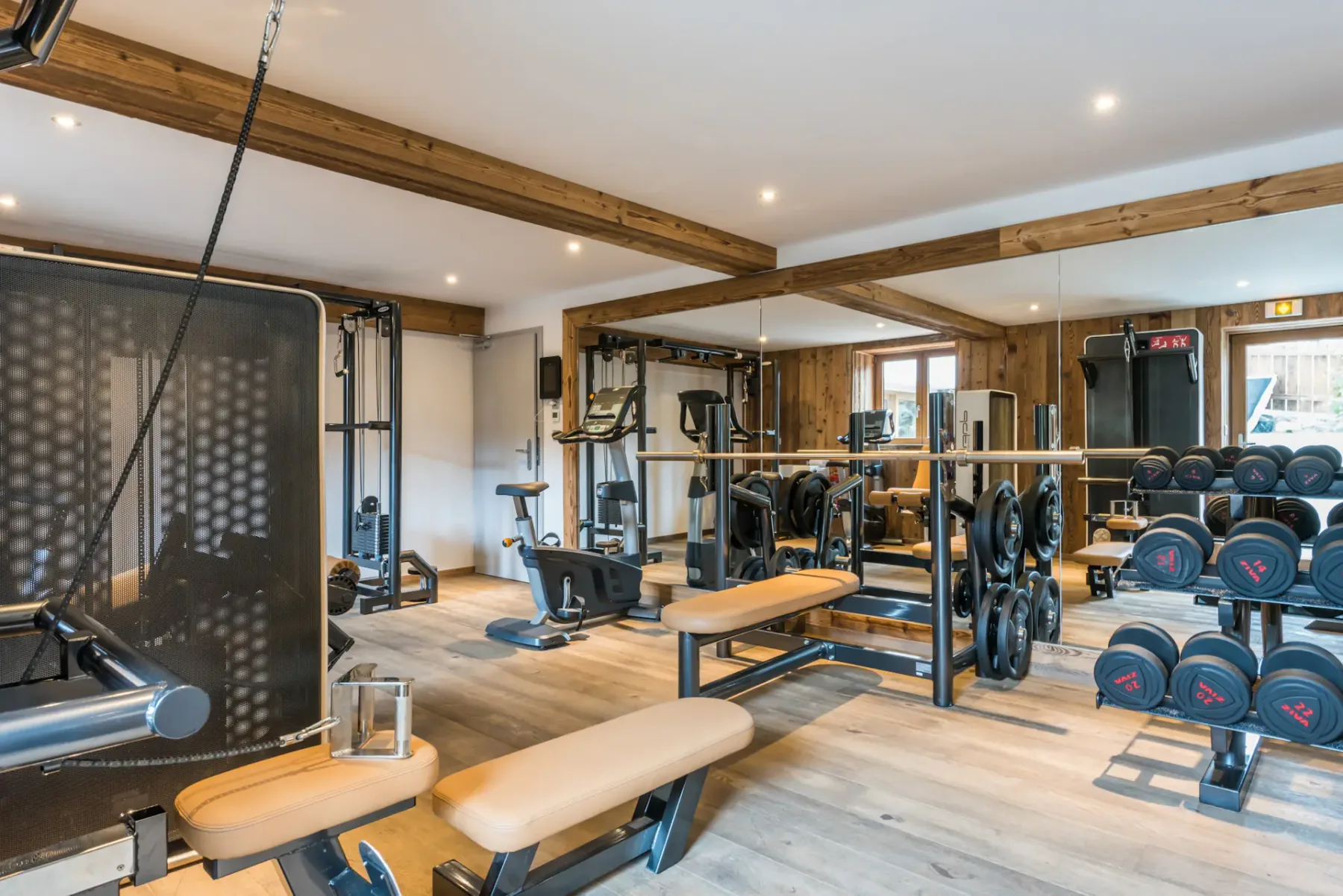 Communal gym machines at the family apartment Kauri Morzine