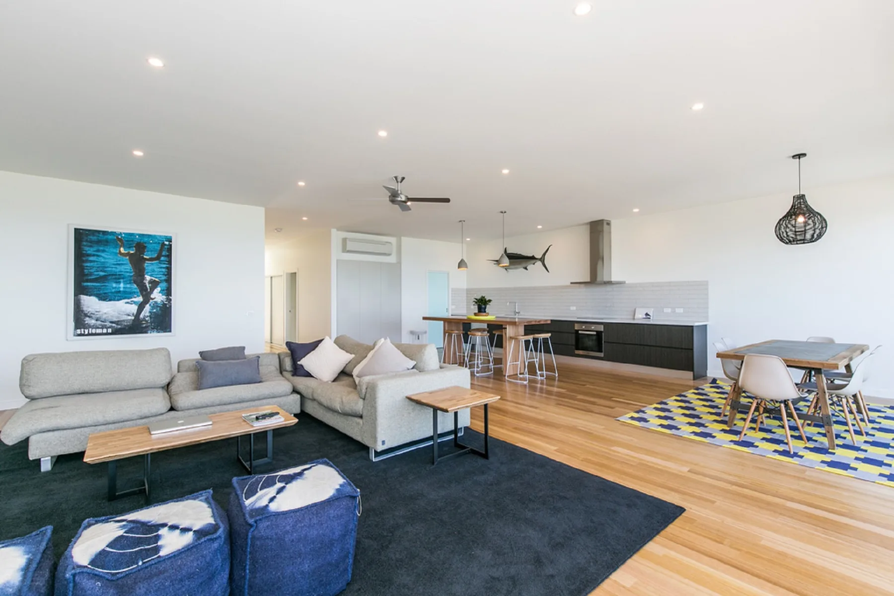 An open-plan living room and kitchen with a dining area.