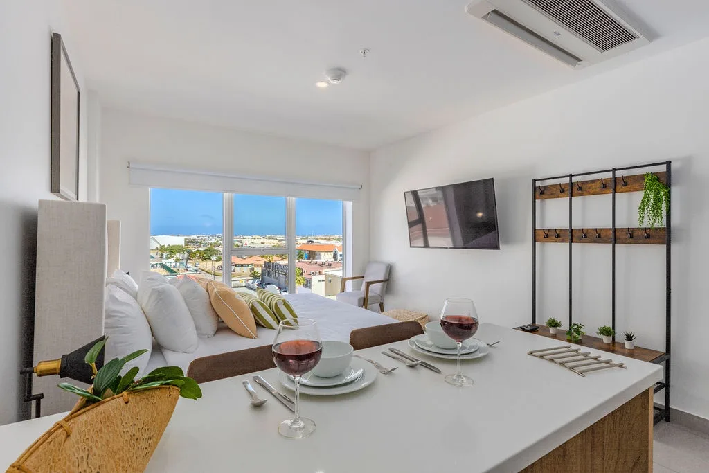 A bright space where dining and relaxation blend seamlessly, with coastal city views framing your meals and modern comfort welcoming you to unwind in style.