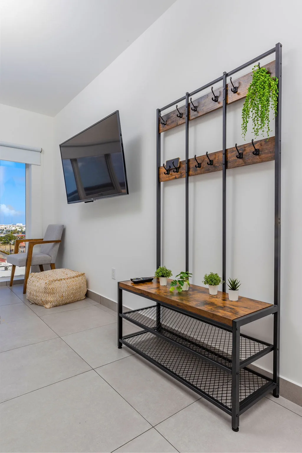Step into your bright, airy entryway with stylish storage for coats and gear. Settle in, unwind, and enjoy the peek of blue skies just beyond your door.