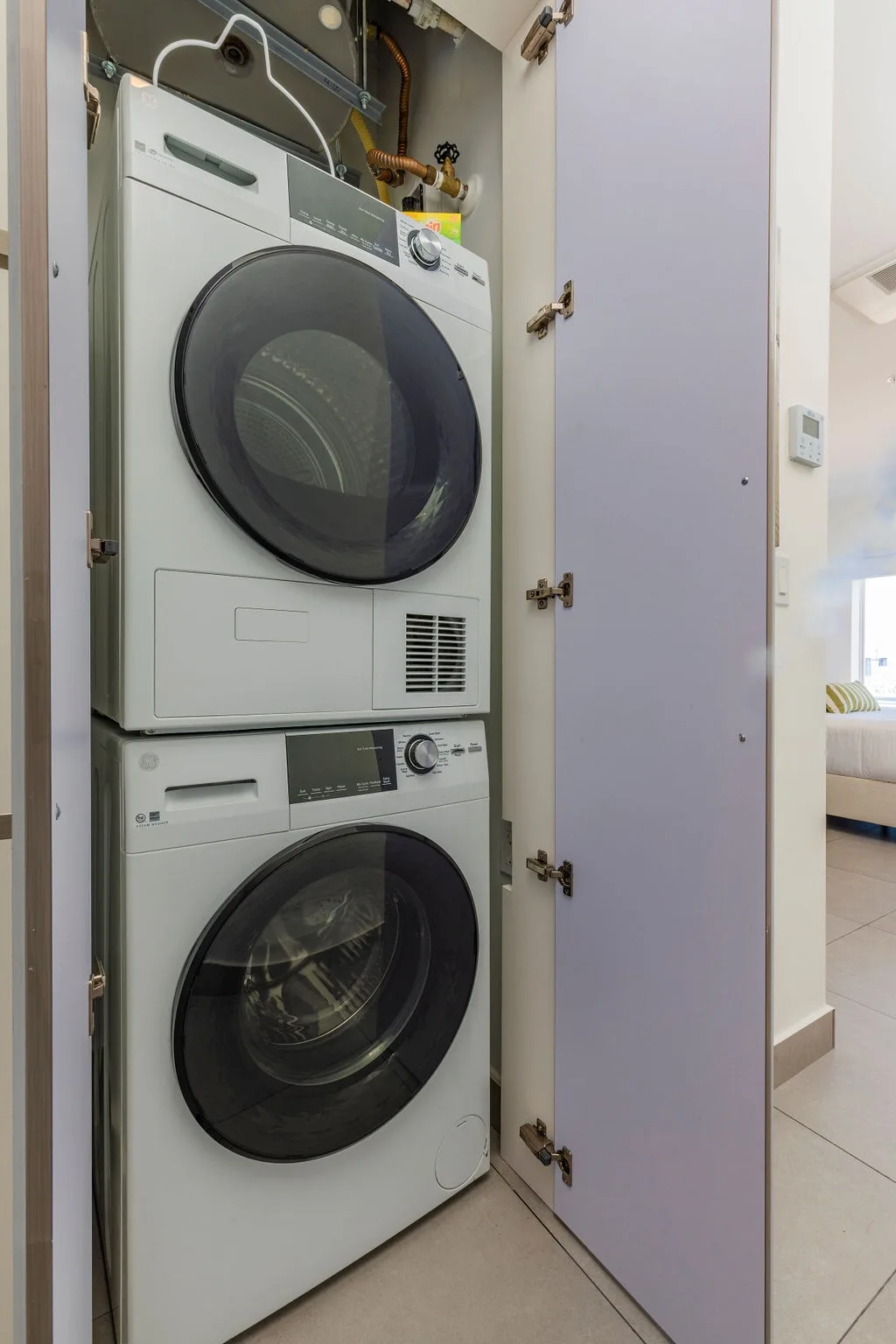 Your in-unit washer and dryer keep travel light and laundry simple, tucked neatly in a closet for easy access anytime you need them.