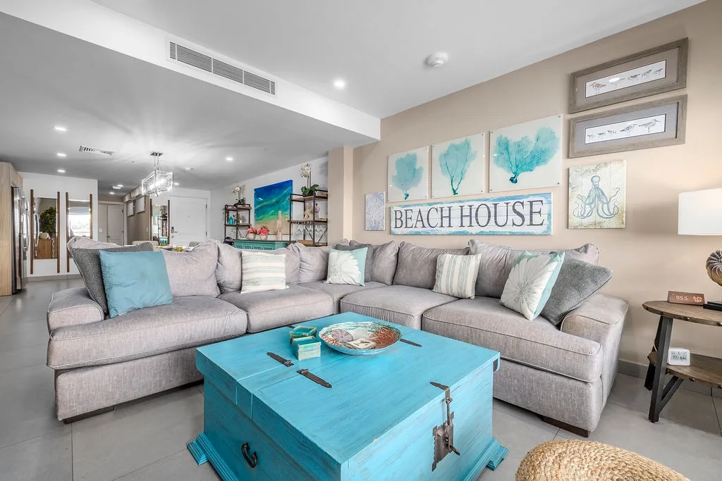 Unwind on plush sectionals surrounded by coastal charm and ocean-inspired decor. The open layout and soothing palette invite you to relax and truly feel at home by the sea.