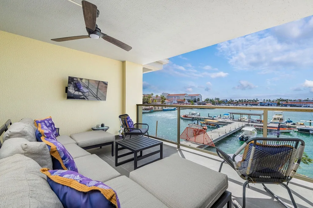 Unwind on your private balcony with sweeping marina views, where turquoise waters and colorful boats create the perfect backdrop for your morning coffee or sunset cocktails.