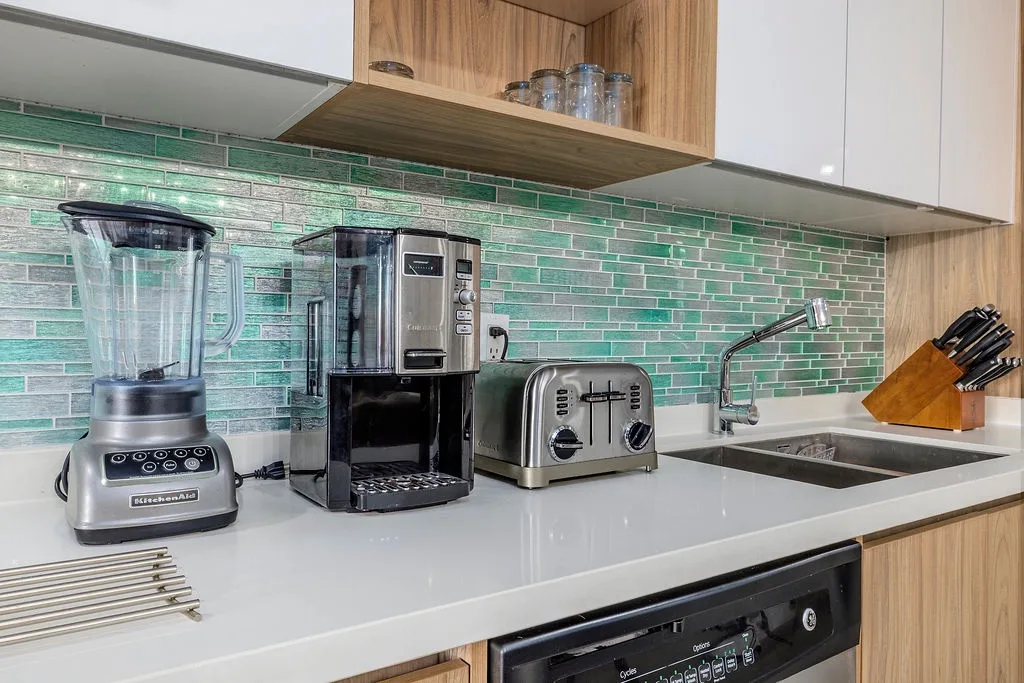 Your fully equipped kitchen awaits with sleek appliances and modern comforts. Brew your morning coffee, whip up fresh meals, and enjoy the ease of having everything you need right at your fingertips.
