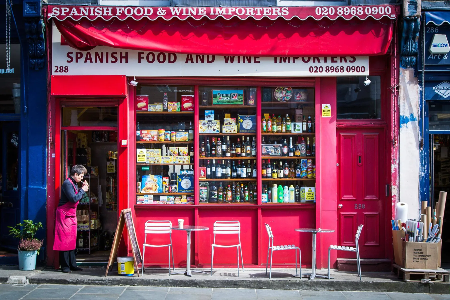 A Spanish food and wine shop with bottles and packaged goods displayed in the front window.