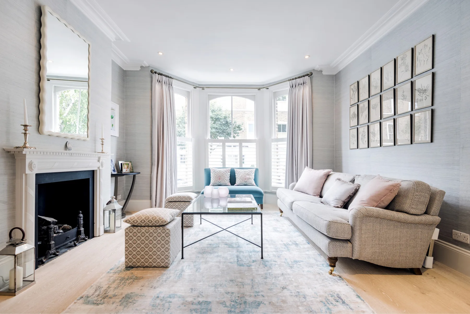 A bright living room with seating arranged around a coffee table.