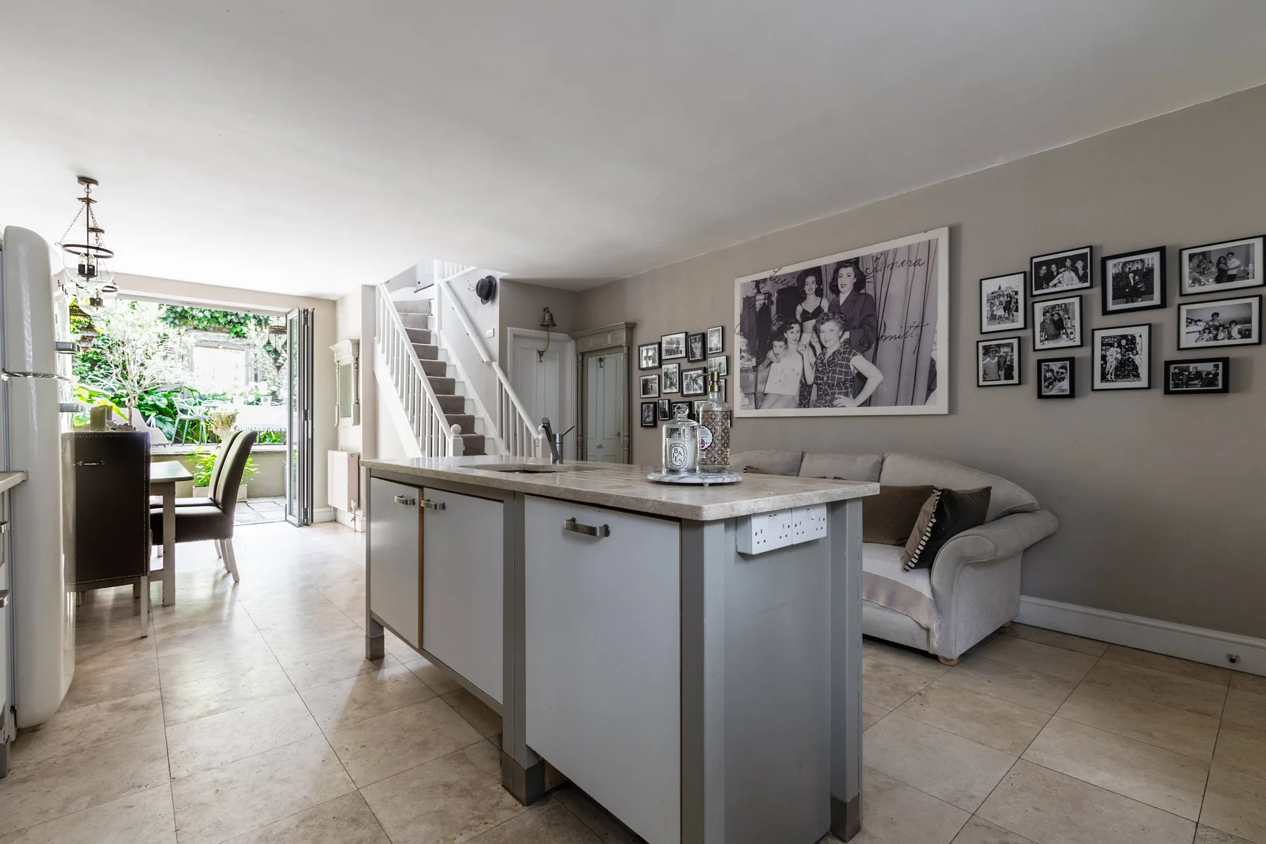 An open-plan kitchen and dining area with a central island and seating.