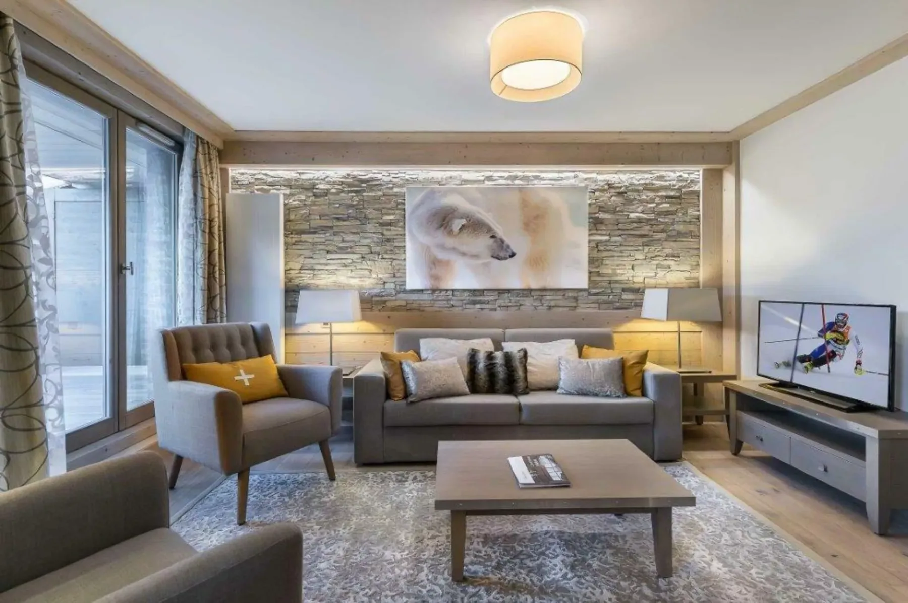 A living room with a sofa, armchair, and coffee table.