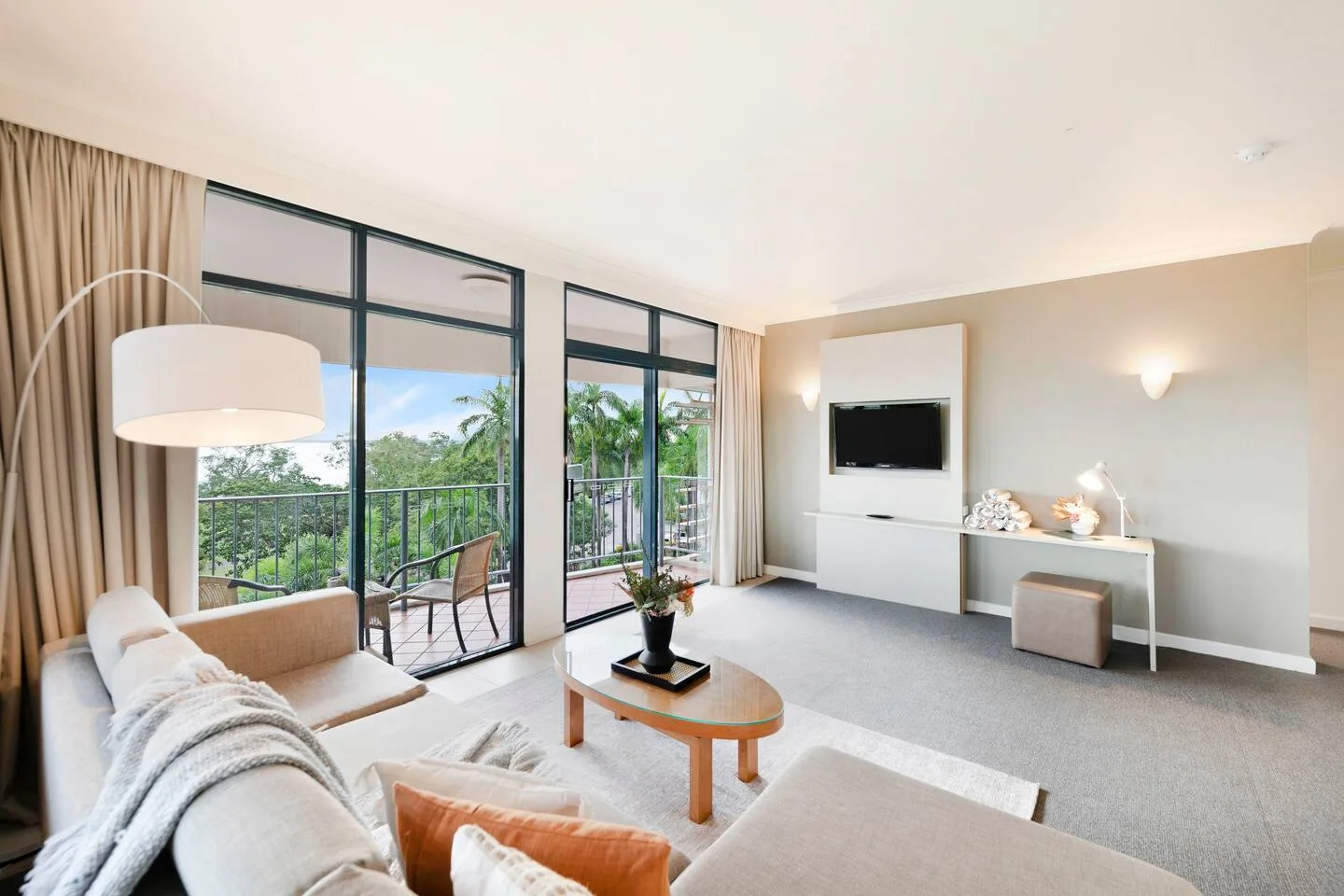 Enjoy leisurely evenings in the inviting living area, complete with a TV for entertainment and seamless access to the adjoining balcony, perfect for soaking up the surrounding views.