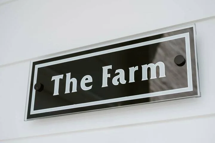 A wall sign reads “The Farm.”