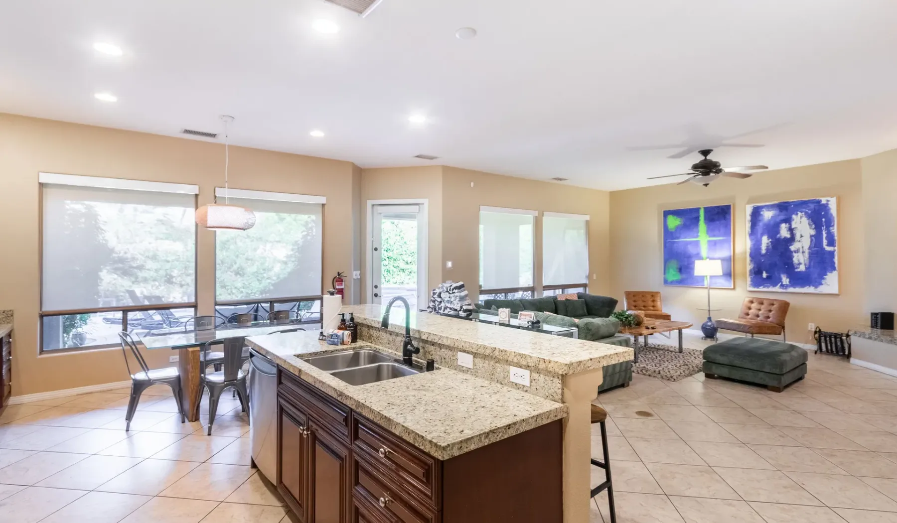 A bright open-plan kitchen and living area with a large central island.