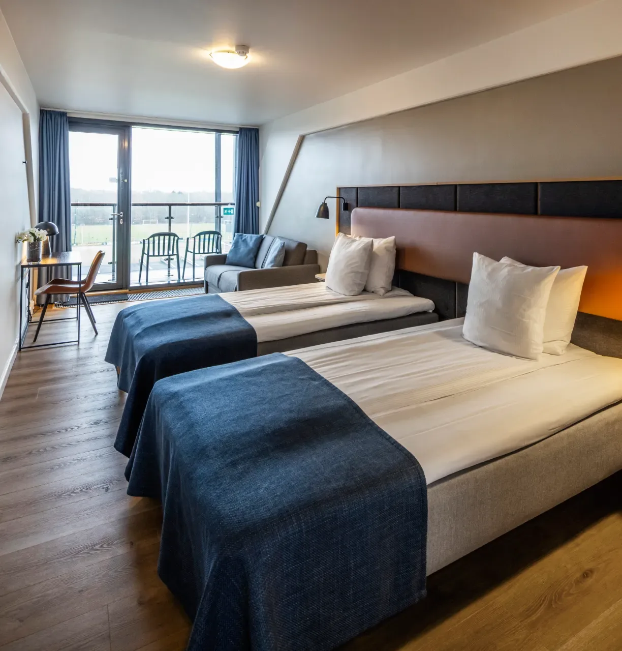 Superior Twin room with two beds and a view over Brøndby Stadium