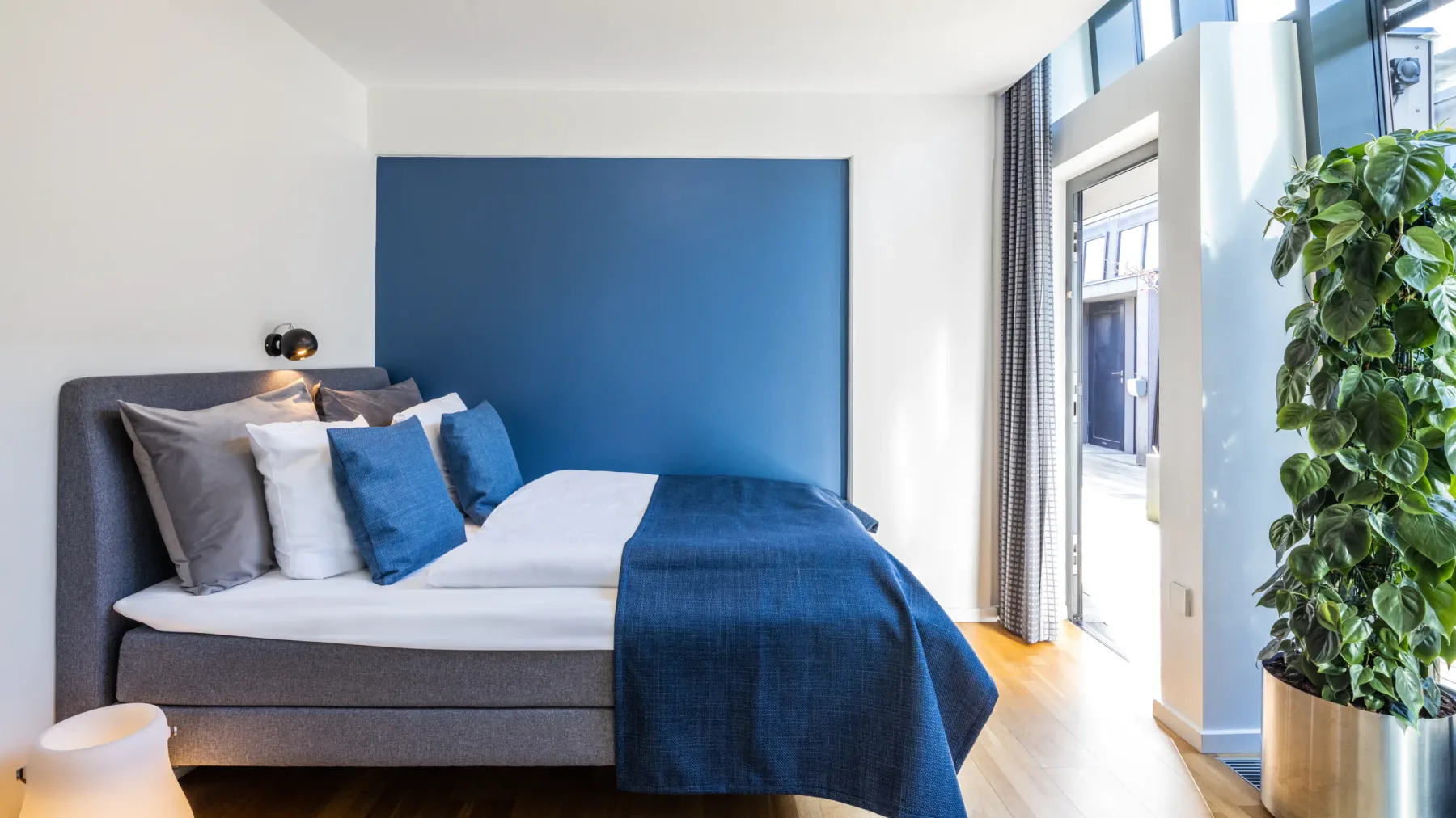 Accessible hotel room with a large bed
