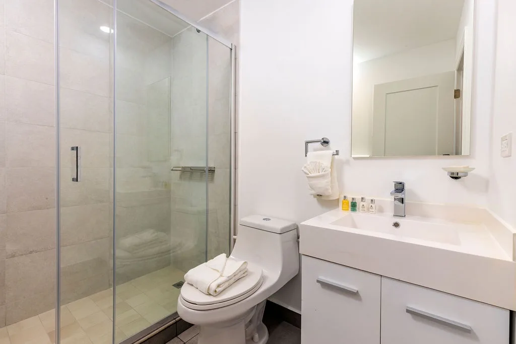 Refresh in your sleek modern bathroom with a spacious glass shower, vanity, and clean contemporary finishes.