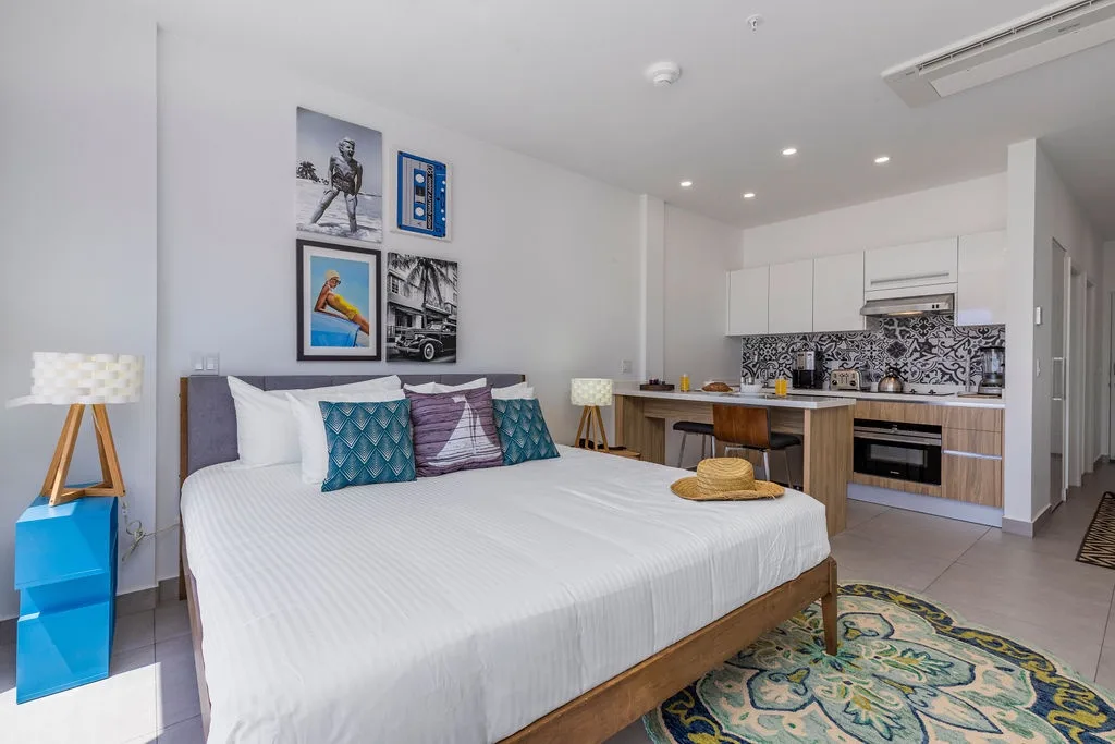 Unwind in your bright studio where modern comfort meets style—crisp linens await after you prepare a fresh meal in your sleek kitchen just steps from bed.