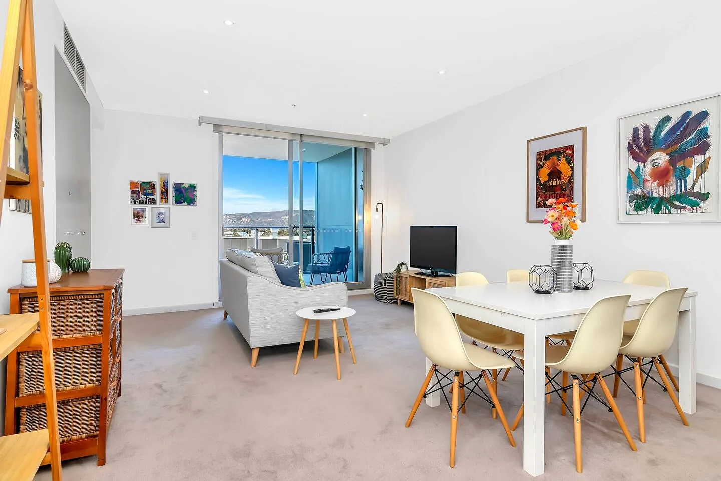 The living room opens to the balcony, creating a lovely transition between the indoors and out.