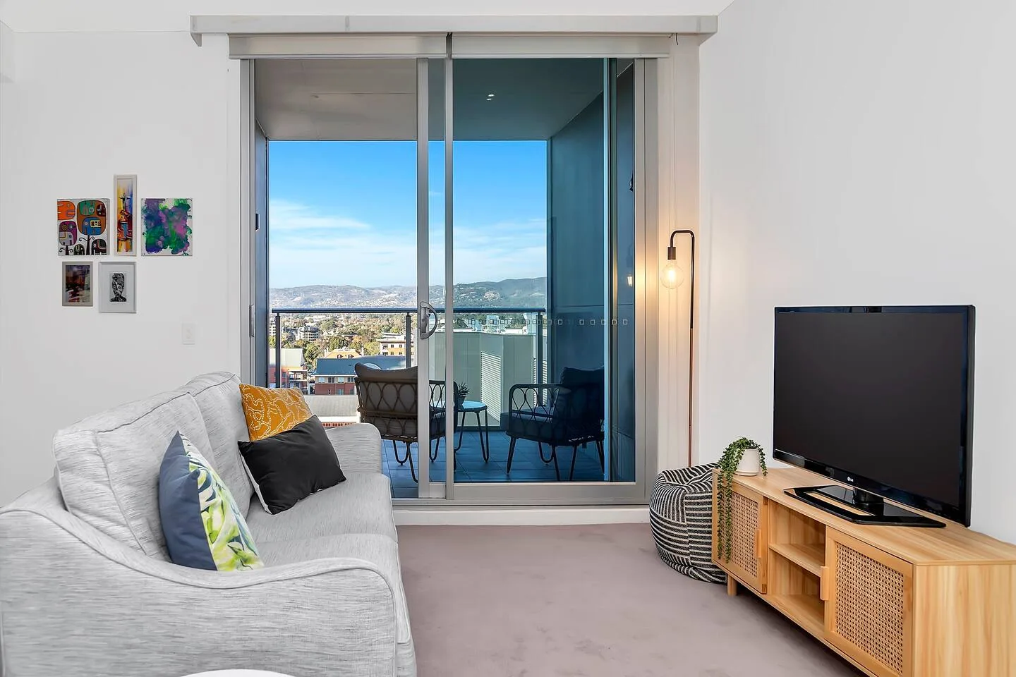 Get comfortable in the living room with plush carpet underfoot and a lounge with a TV.