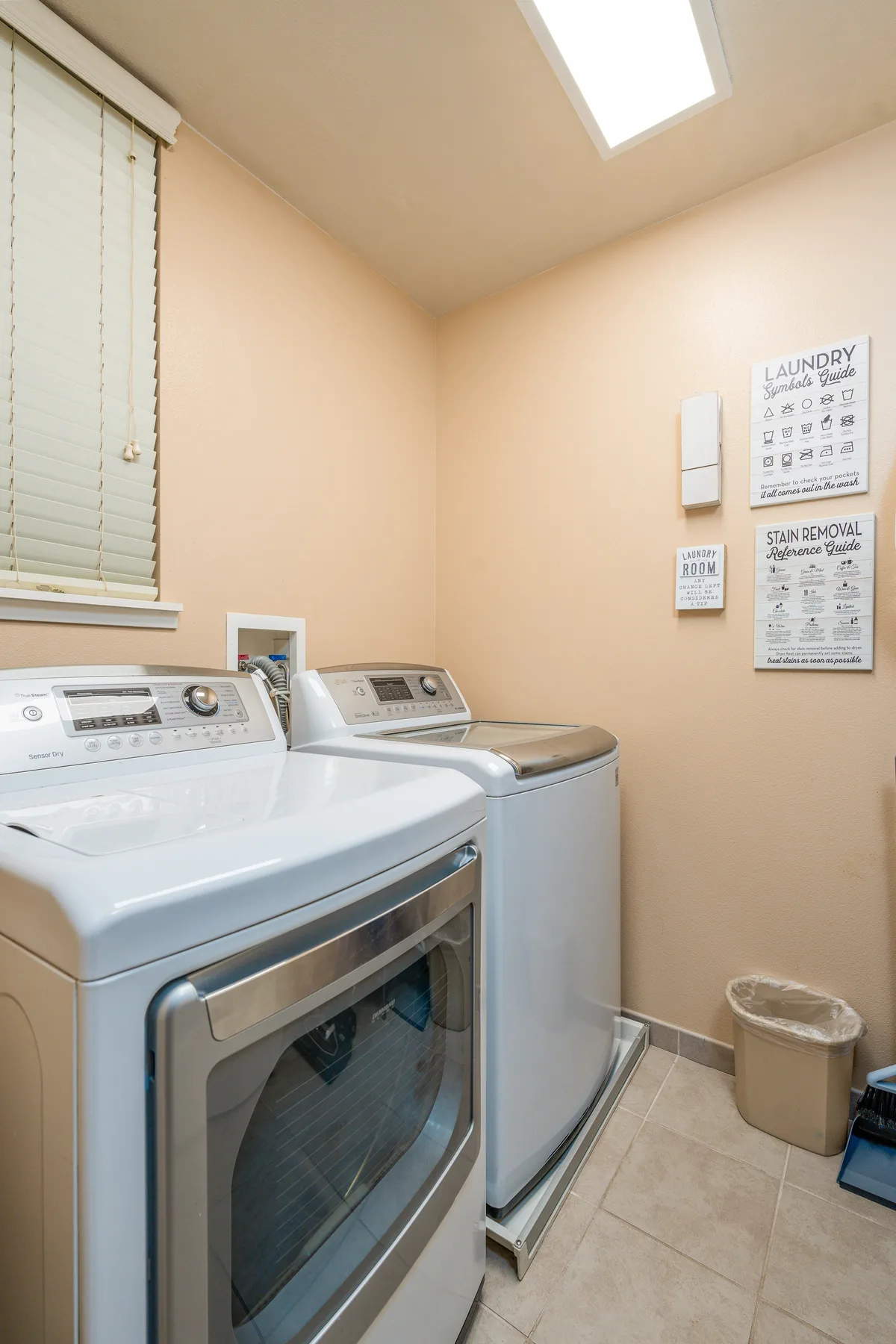 A laundry room with a front-loading washer and dryer.