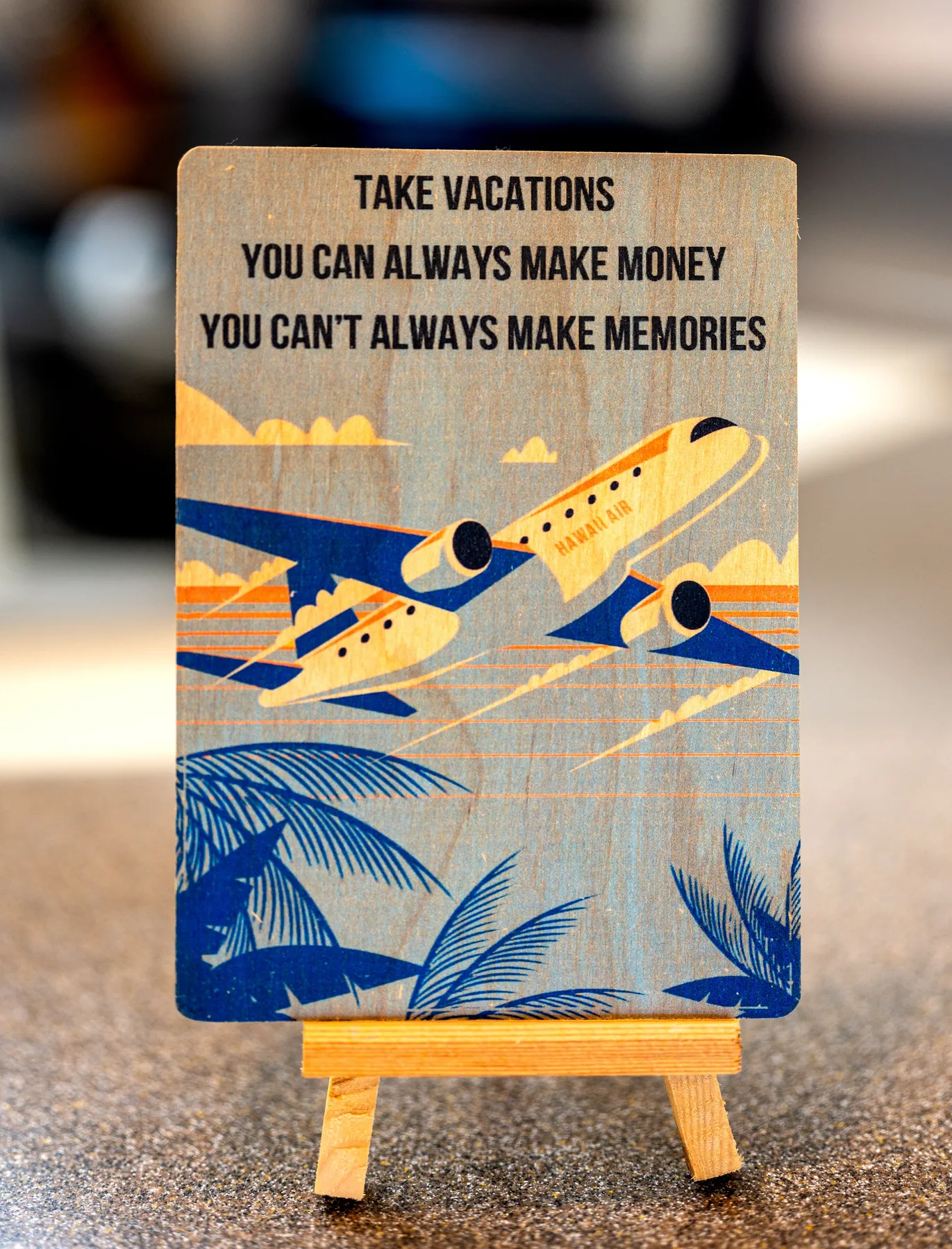 A printed travel sign showing airplanes above a tropical beach scene.