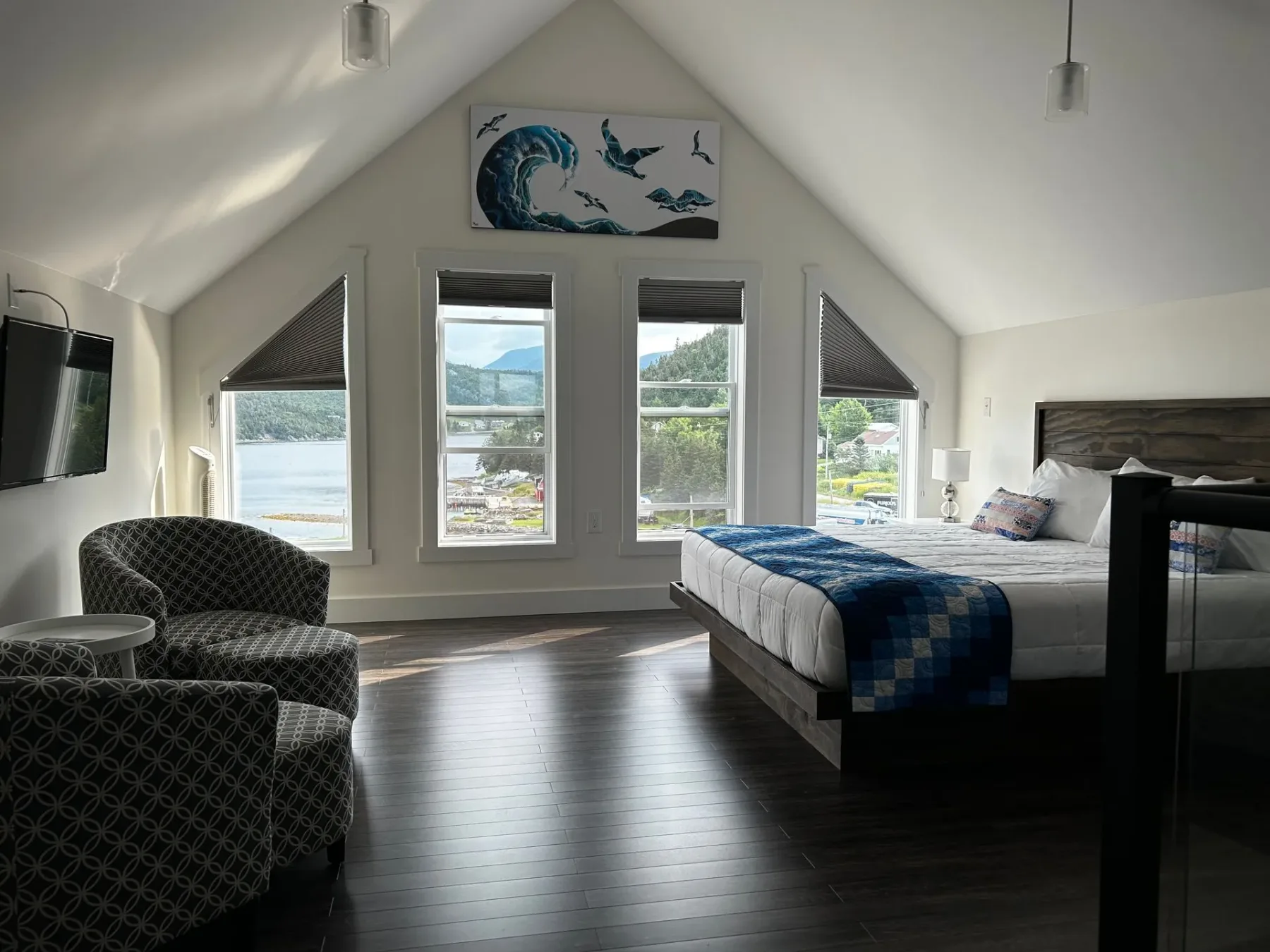 Bedroom with a king bed and two chairs