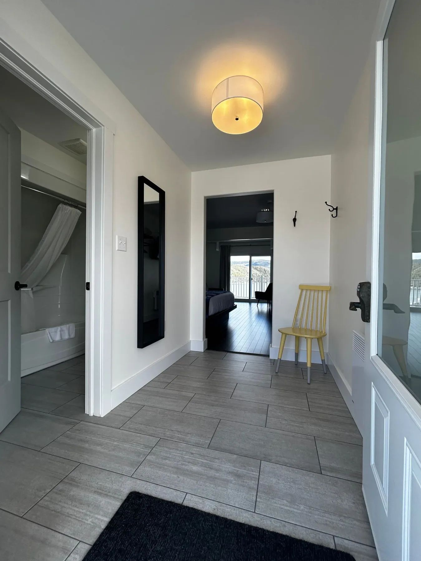 Hallway with a chair and wall mirror