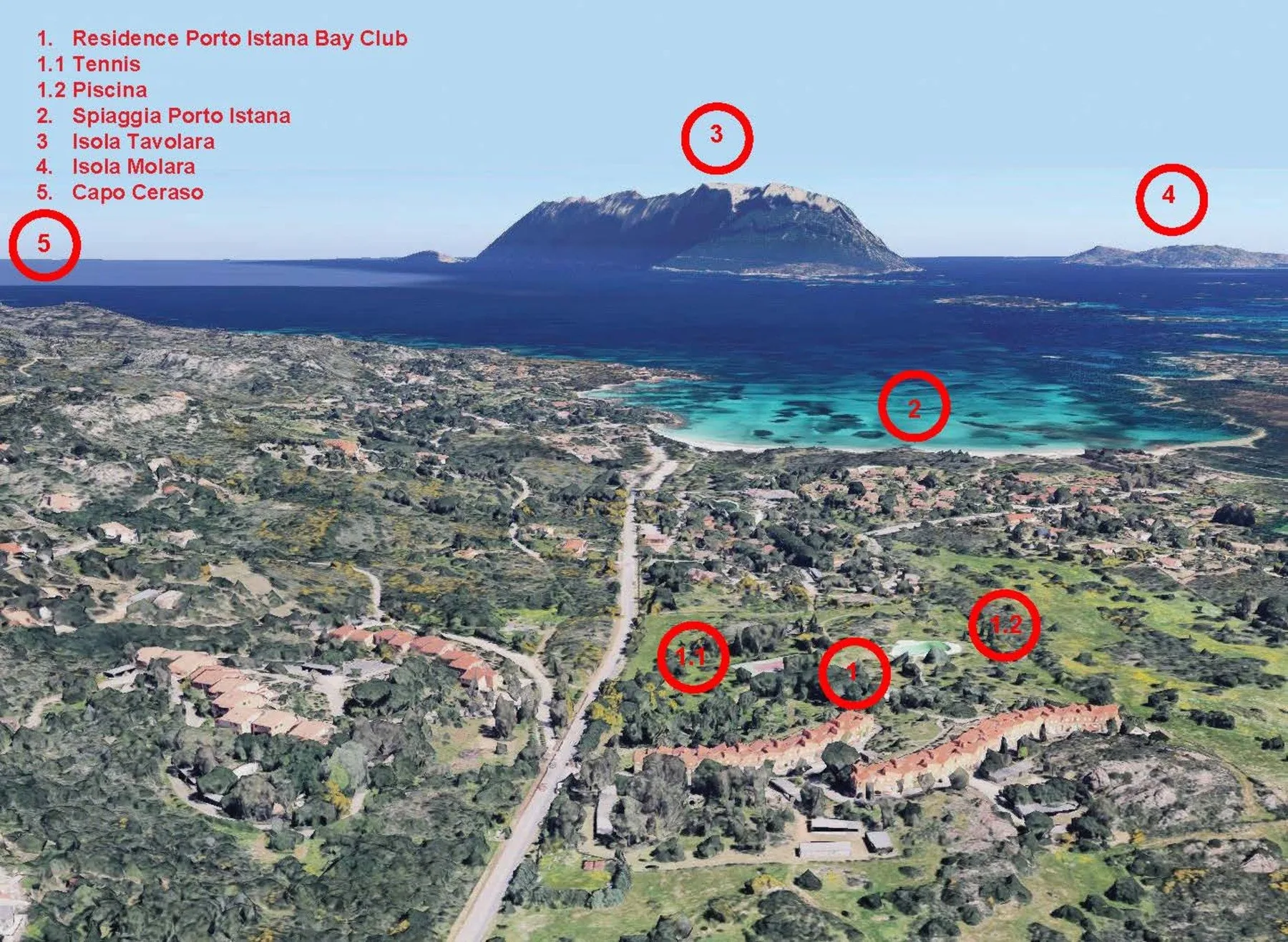 An aerial view shows a coastal settlement beside a turquoise bay and distant islands.