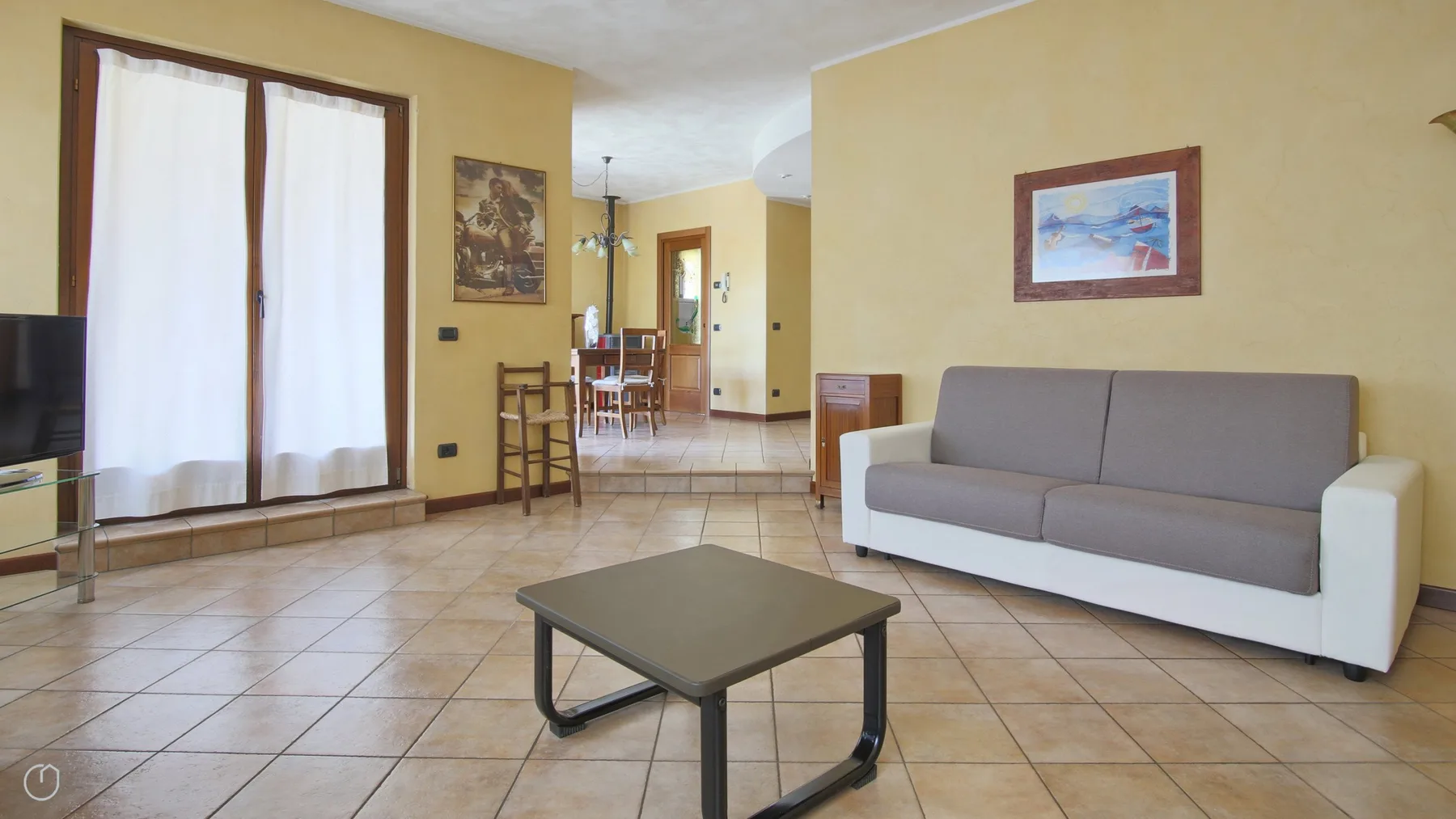 A living room with gray seating and a low coffee table.