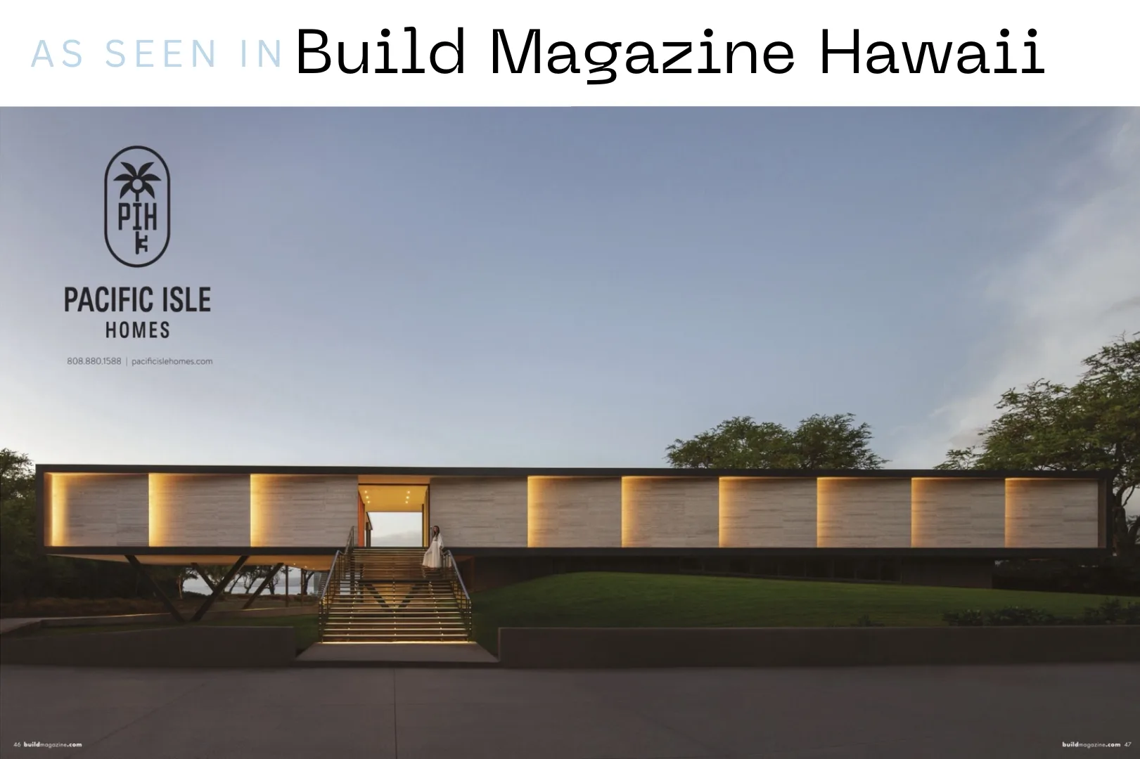 A modern, low-profile building glows with warm light at dusk.