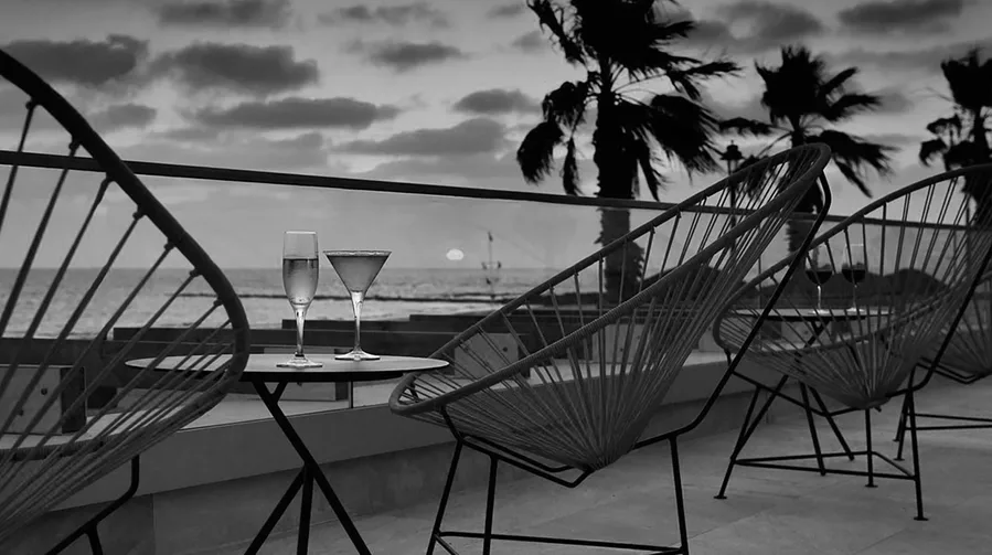 Hotel terrace with sea views at sunset.