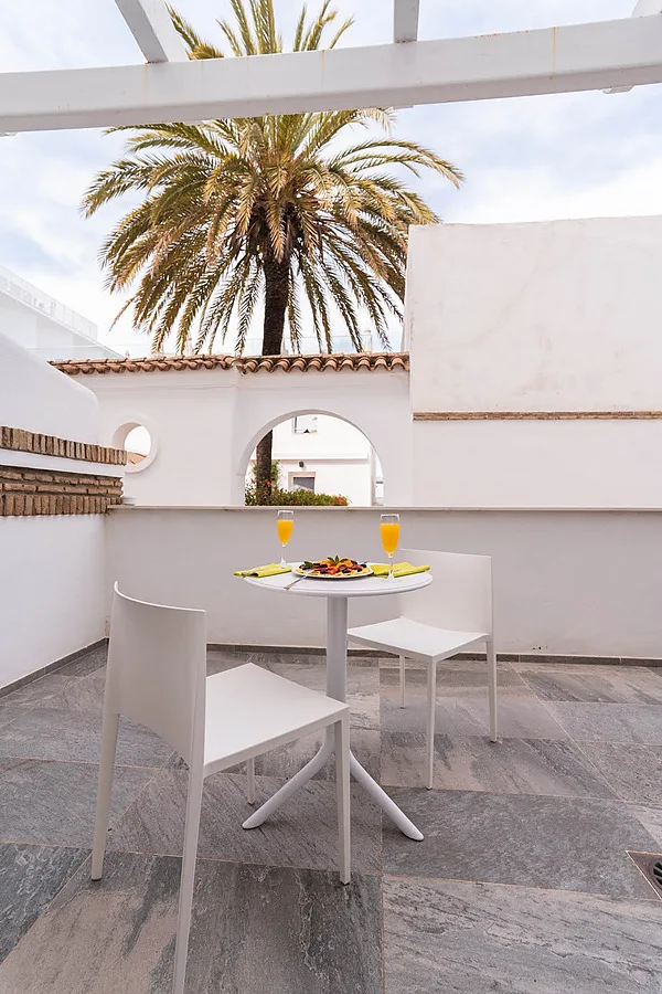 Breakfast set on the hotel terrace.
