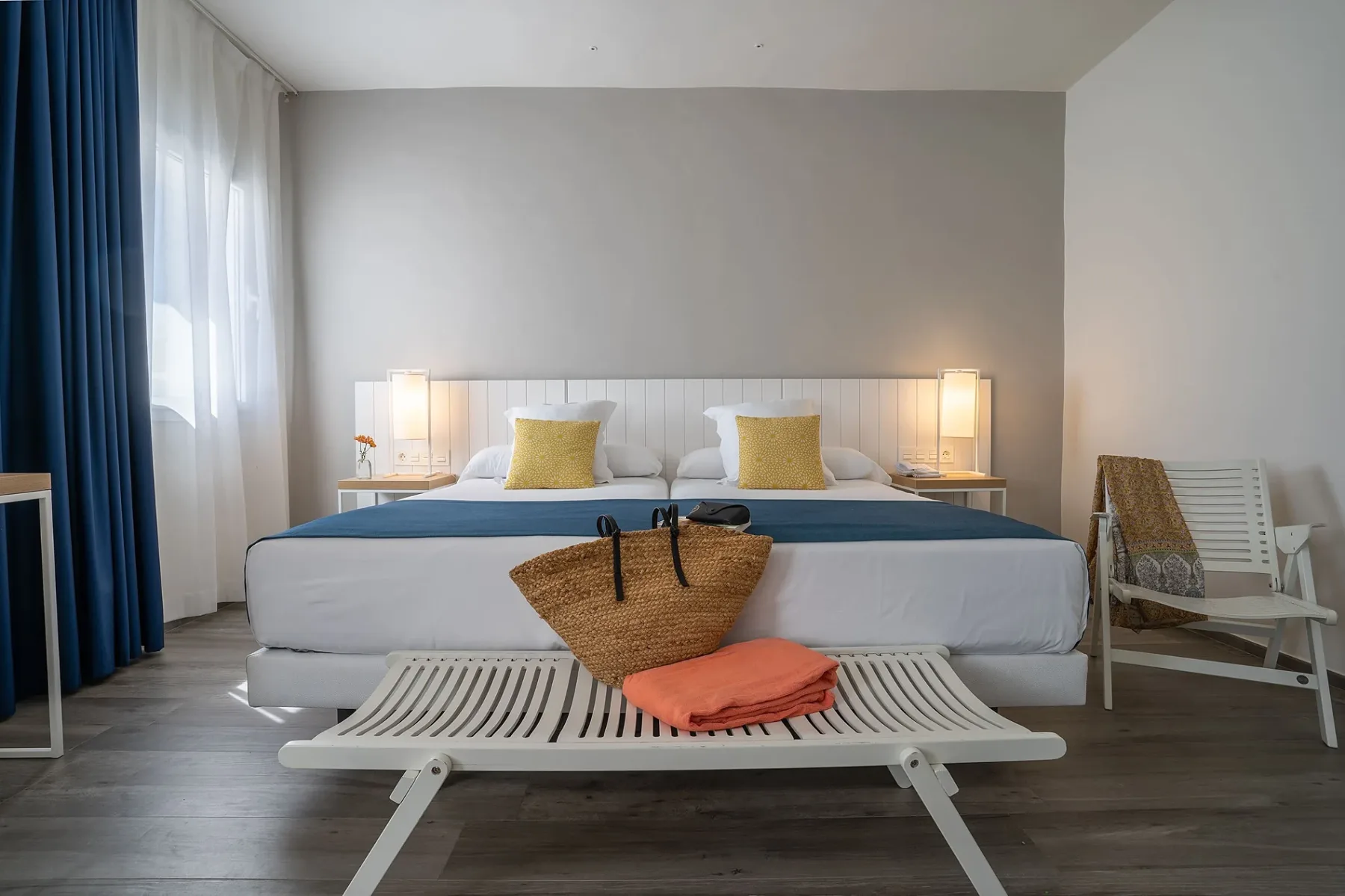 Modern hotel room with a double bed.