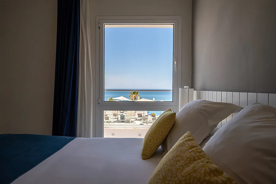 Hotel room overlooking the pool and sea.