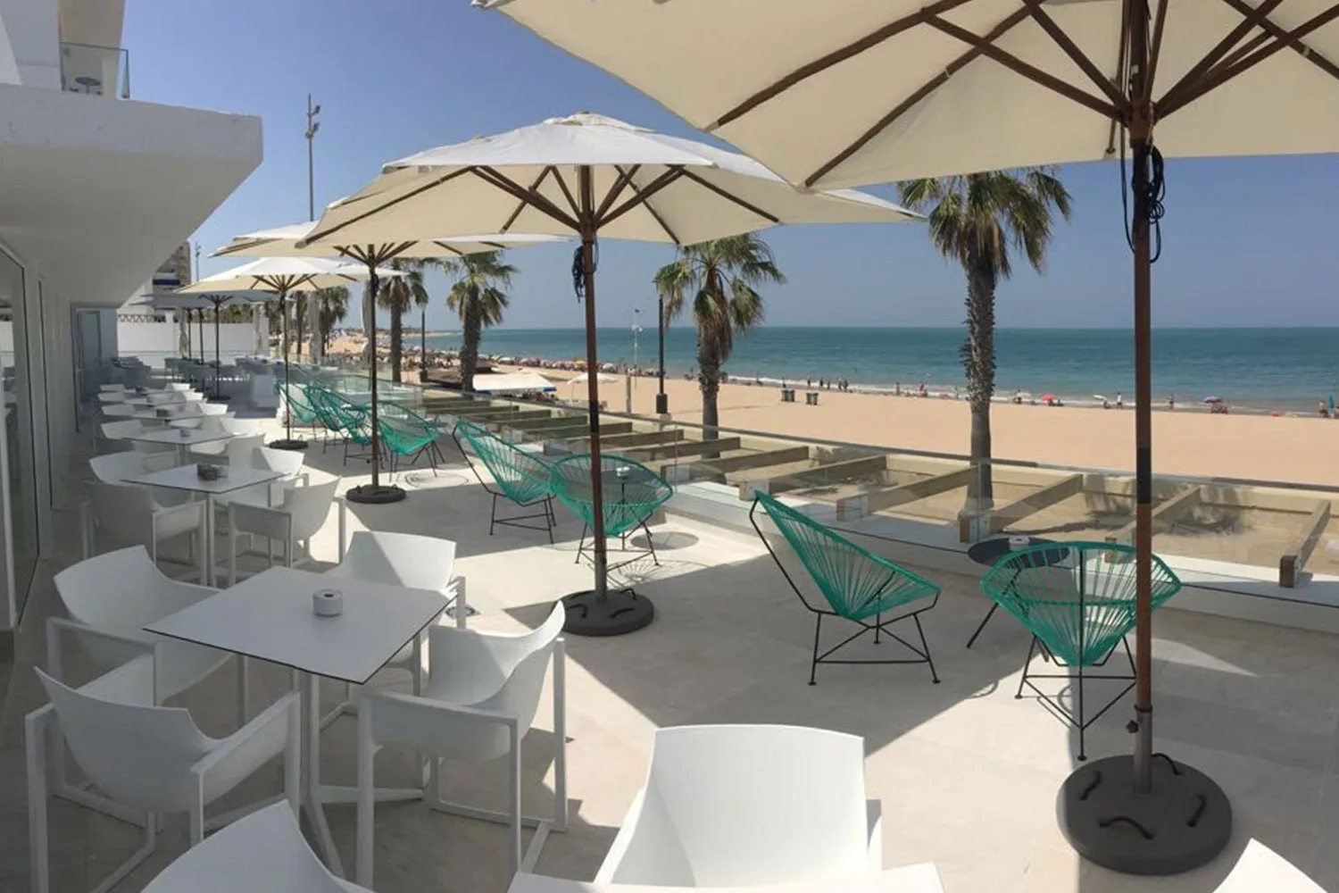 Hotel terrace with beach and sea views.