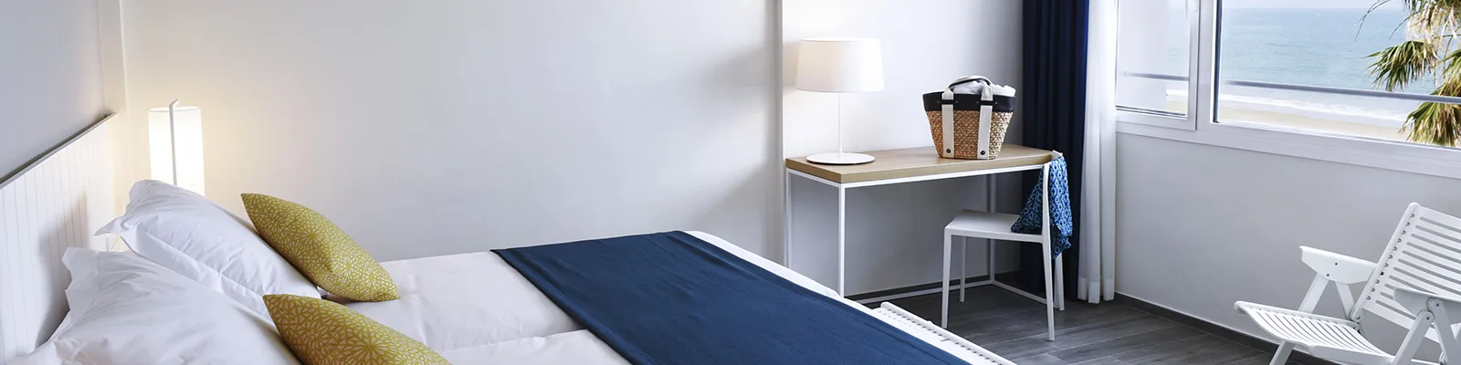 Bright hotel room with sea views.